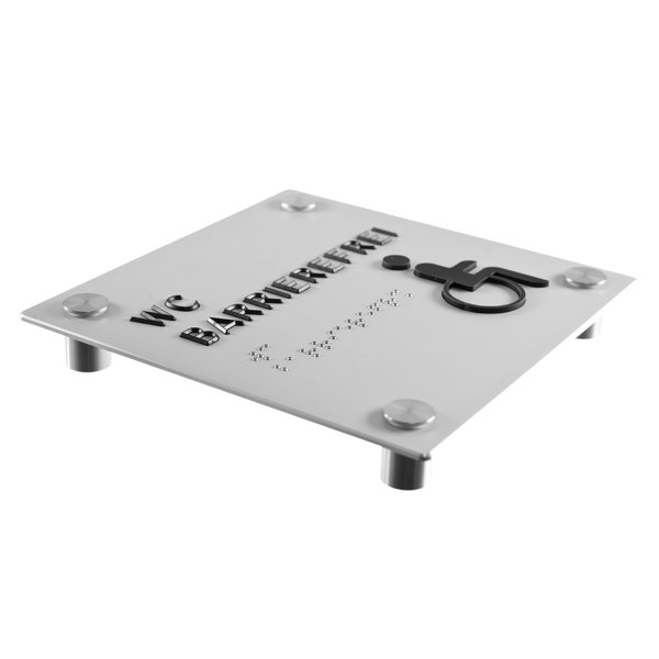 Taktiles Schild mit der Aufschrift WC barrierefrei darunter der Text in Brailleschrift